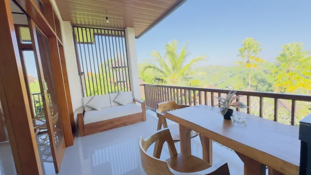 Balcony overlooking tropical greenery at Jambangan Bali Villa Ubud