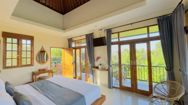 Cozy bedroom with elegant furnishings at Jambangan Bali Villa Ubud